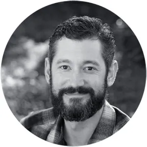 Professional headshot of a team member with a friendly, approachable expression